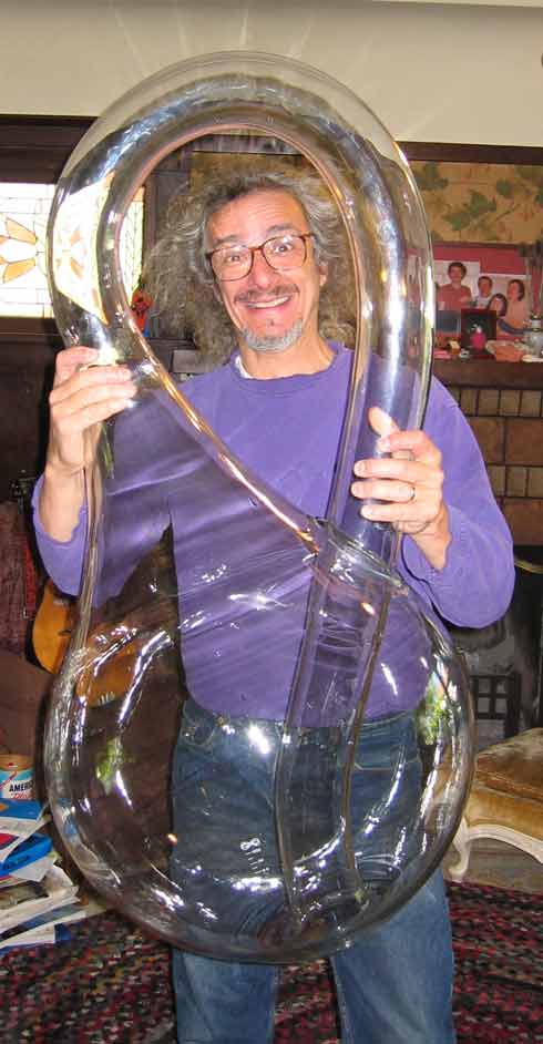 Cliff Stoll in front of giant Klein Bottle