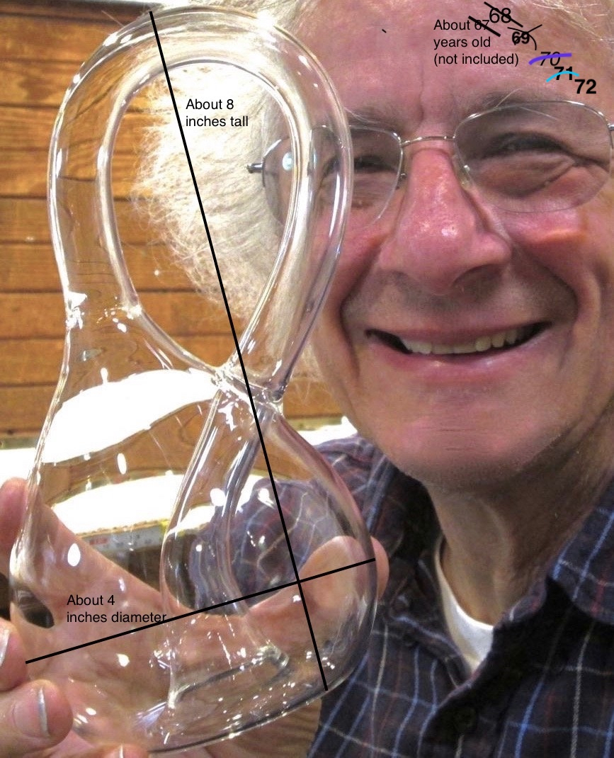Cliff Stoll holding a big glass Klein Bottle