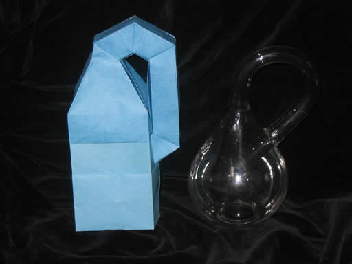 Robert Lang's Origami Klein Bottle next to a Glass Acme Klein Bottle